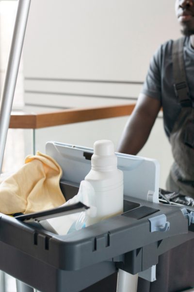 man-walking-with-cleaning-cart